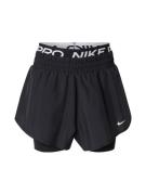 NIKE Urheiluhousut  musta / valkoinen
