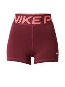 NIKE Urheiluhousut  oranssi / tummanpunainen / valkoinen
