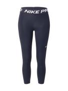 NIKE Urheiluhousut  musta / valkoinen